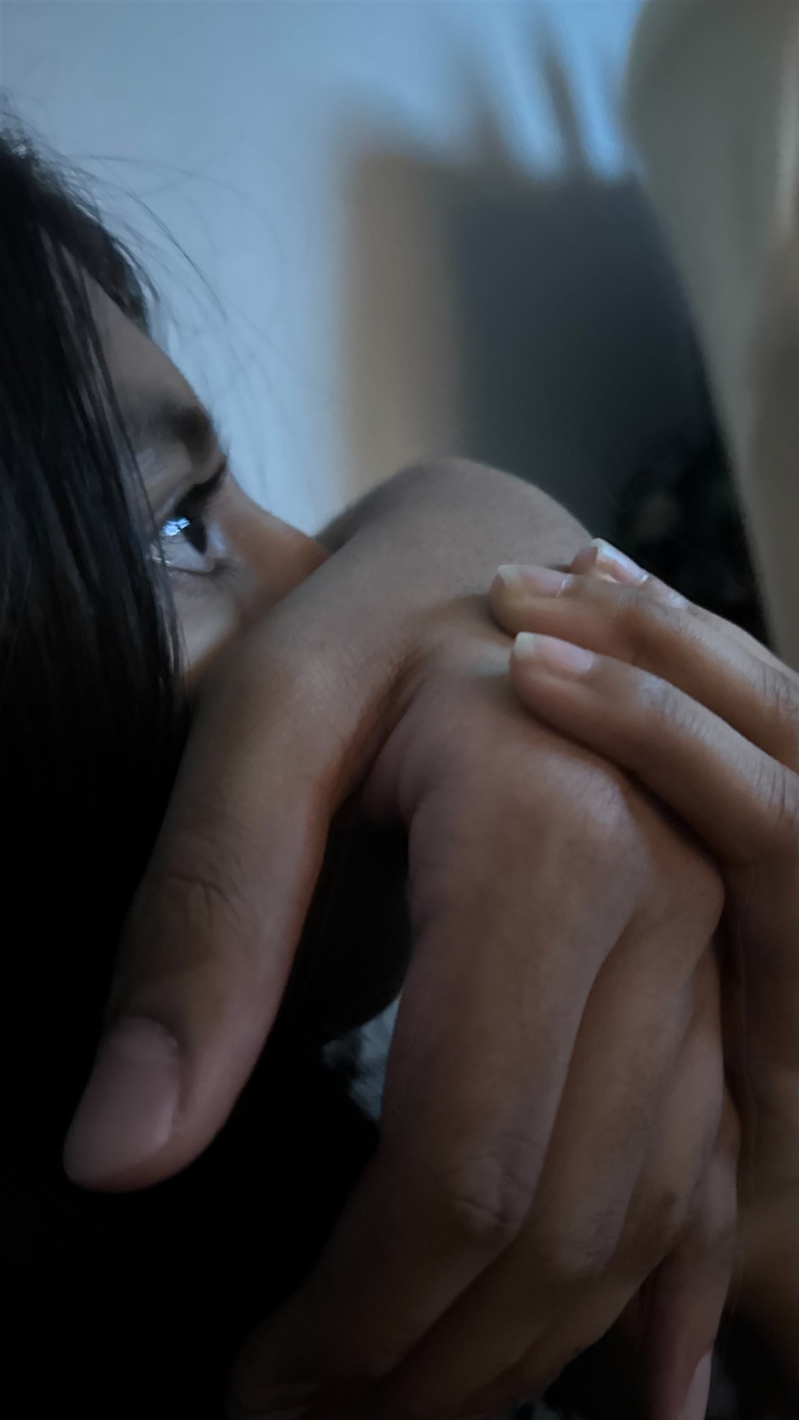 Our hands together during a horror movie at her house