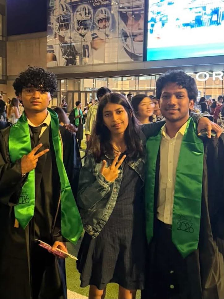 Anju with two friends at a school event